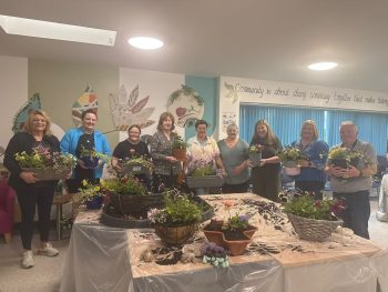 Foster Carer Jayne Scott (second from left) together with others and horticultural expert Martin Burns as they attend the annual South Eastern Health and Social Care Trust hosted a ‘bring your own basket’ event at Ballynahinch’s Grove House.