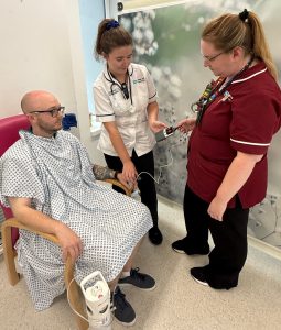 Laura Davey (Respiratory Nurse) and Caoimhe McArdle (Physiotherapist) with a respiratory patient