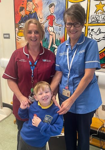 Sinead Stevenson (Specialist Community Public Health Nurse, South Eastern Trust), Isobel Quinn (Public Health School Nurse, South Eastern Trust) And P1 Pupil, Enzo Gressani