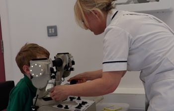 Jennifer Patterson (South Eastern Trust Orthoptic Professional Lead) Carrying Out An Eye Exam On A Child