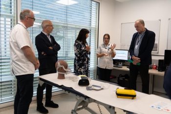 Prof Ian Young, Roisin Coulter And Mike Farrar Hearing About The Acupebble Device