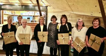Celebrating 40 plus years of service are Margaret McGreevy, Rosaleen Slack, Elizabeth Johnston, Angela Cleland, Caroline Allen together with Chief Social Worker Aine Morrison and South Eastern Trust Director of Primary Care and Older People Veronica Cleland